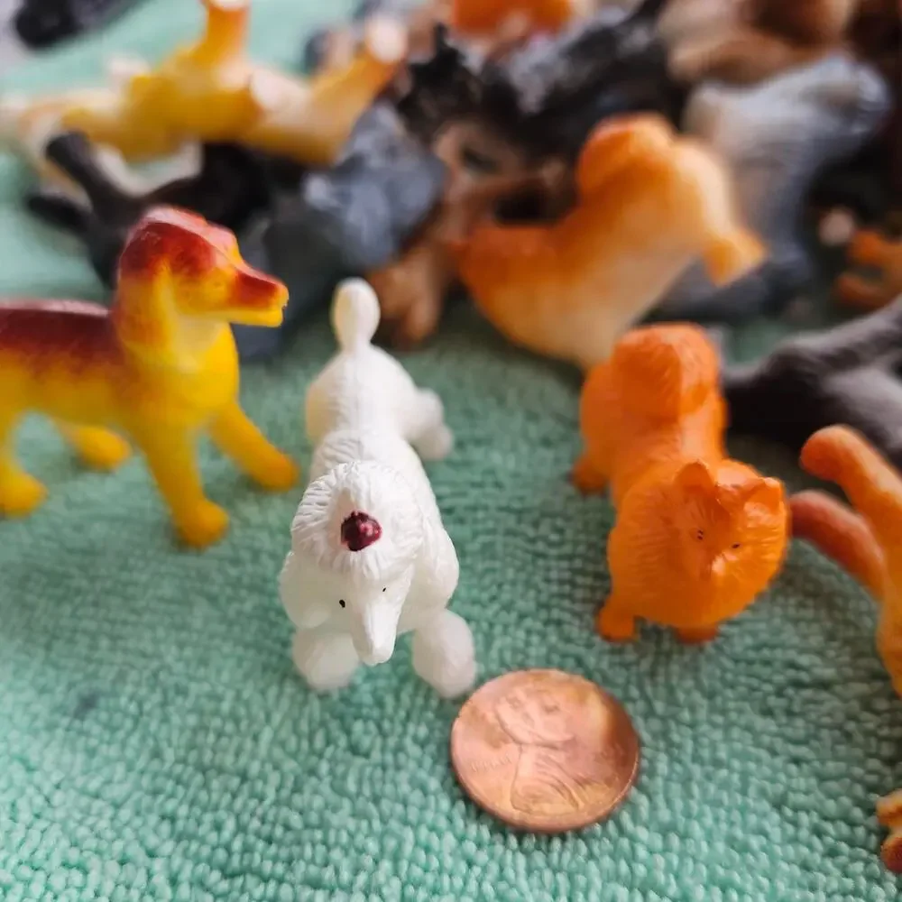 61 multi colored plastic dog figurines